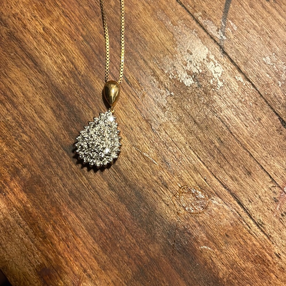 Lovely genuine diamond teardrop necklace set in solid 10k yellow gold